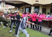 Polres Kolaka Utara Meriahkan HUT RI ke-80: Jalan Santai, Lomba Seru, dan Beras Murah Diserbu Warga!